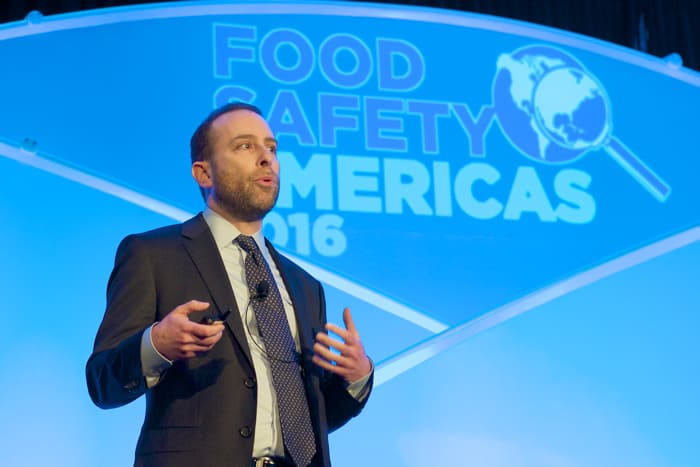 Evan Rosen Vice President of QA at PacMoore Speaking on stage at a Food Safety Americas Conference in 2016