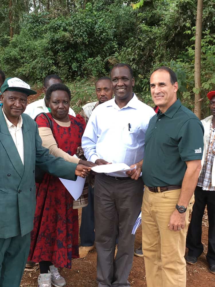 The official signing of the agreement between PacMoore and the local community group to work together on the Kenya honey project.